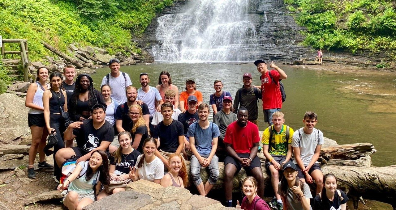 Students by a waterfall